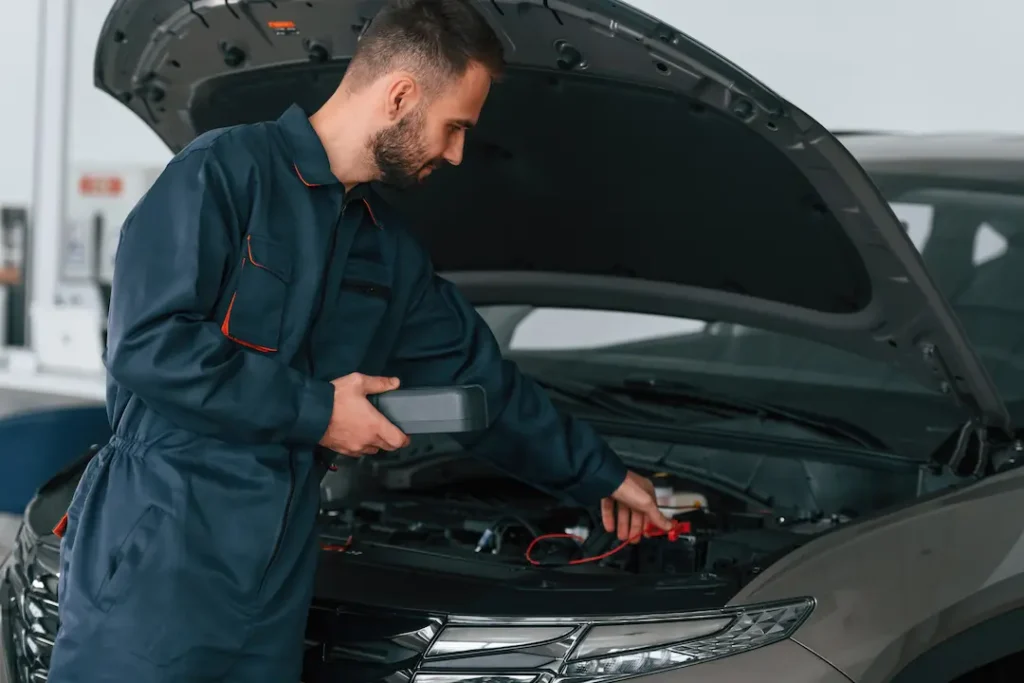 Mechanic checking transmission